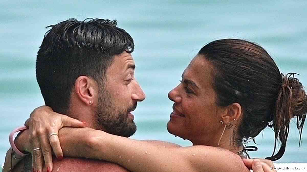Ex Strictly star Giovanni Pernice looks smitten with bikini-clad girlfriend Bianca Guaccero as they enjoy another romantic beach day in Barbados