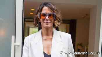 Halle Berry looks effortlessly chic in a white blazer as she joins stylish Rosie Huntington-Whiteley and Kristen Stewart in leading the stars stepping out on day four of Cannes Film Festival