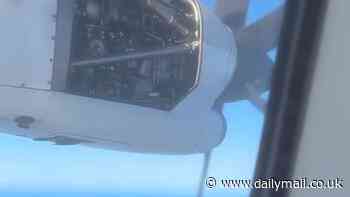 Terrifying moment passenger plane's engine breaks apart in mid-air