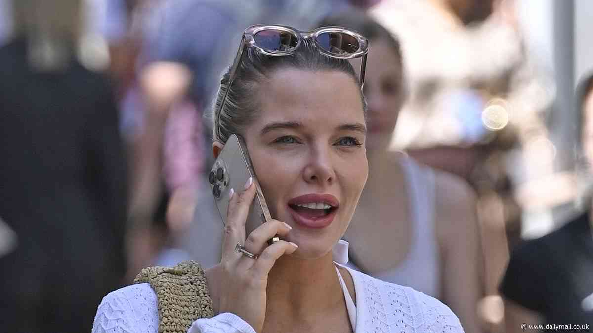 Helen Flanagan shows off her toned curves in a white maxi dress as she steps out in Gibraltar - after putting her house on the market for £1.5m