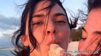 Kendall and Kylie Jenner are 'drunk' on vodka as they model tiny bikinis while frolicking on the beach