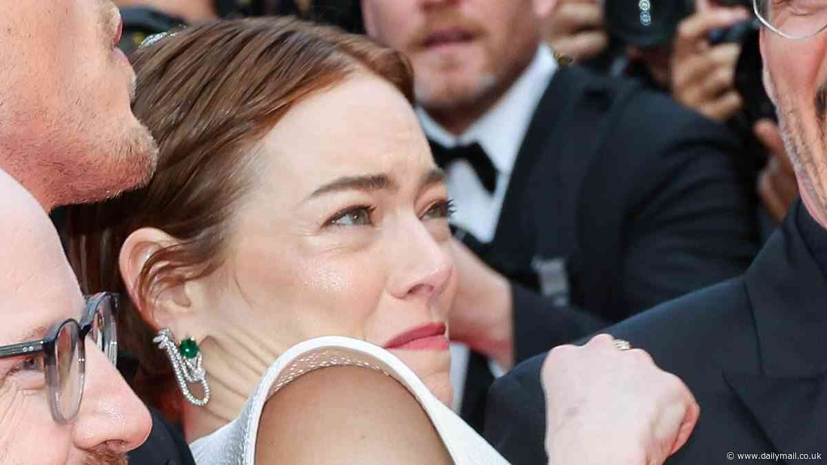 Emma Stone appears to have epic red carpet meltdown as Hollywood heartthrob comes to her rescue