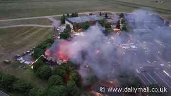 Inferno at former RAF base kills two firefighters in service's worst day for 15 years