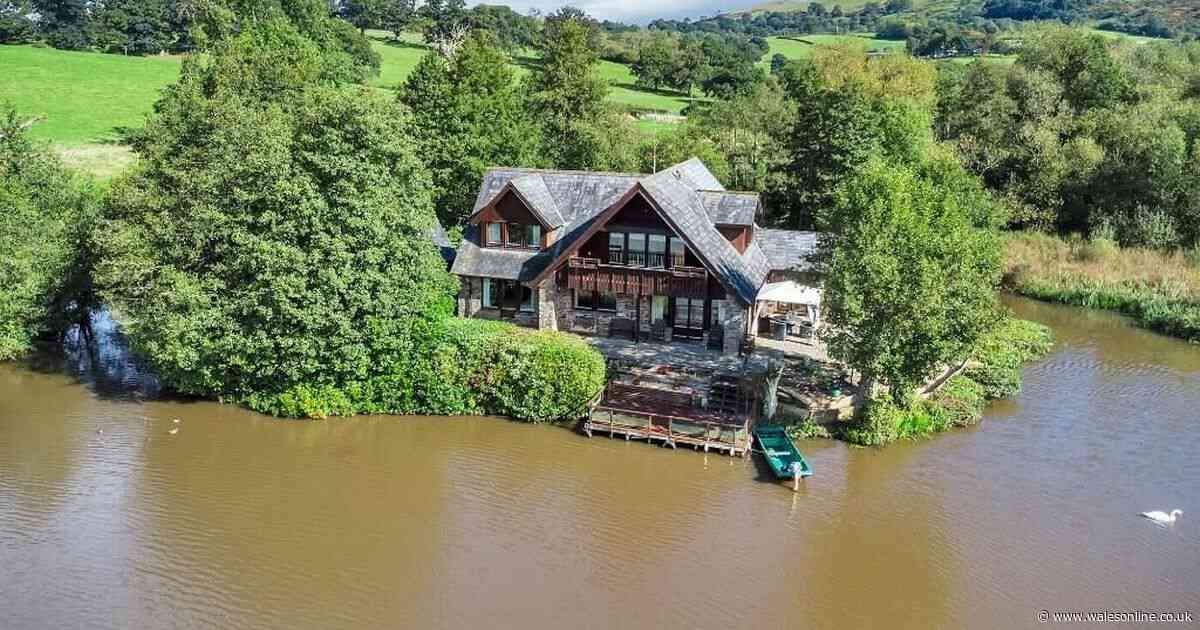 Incredible home sits on lake with private islands you can row to
