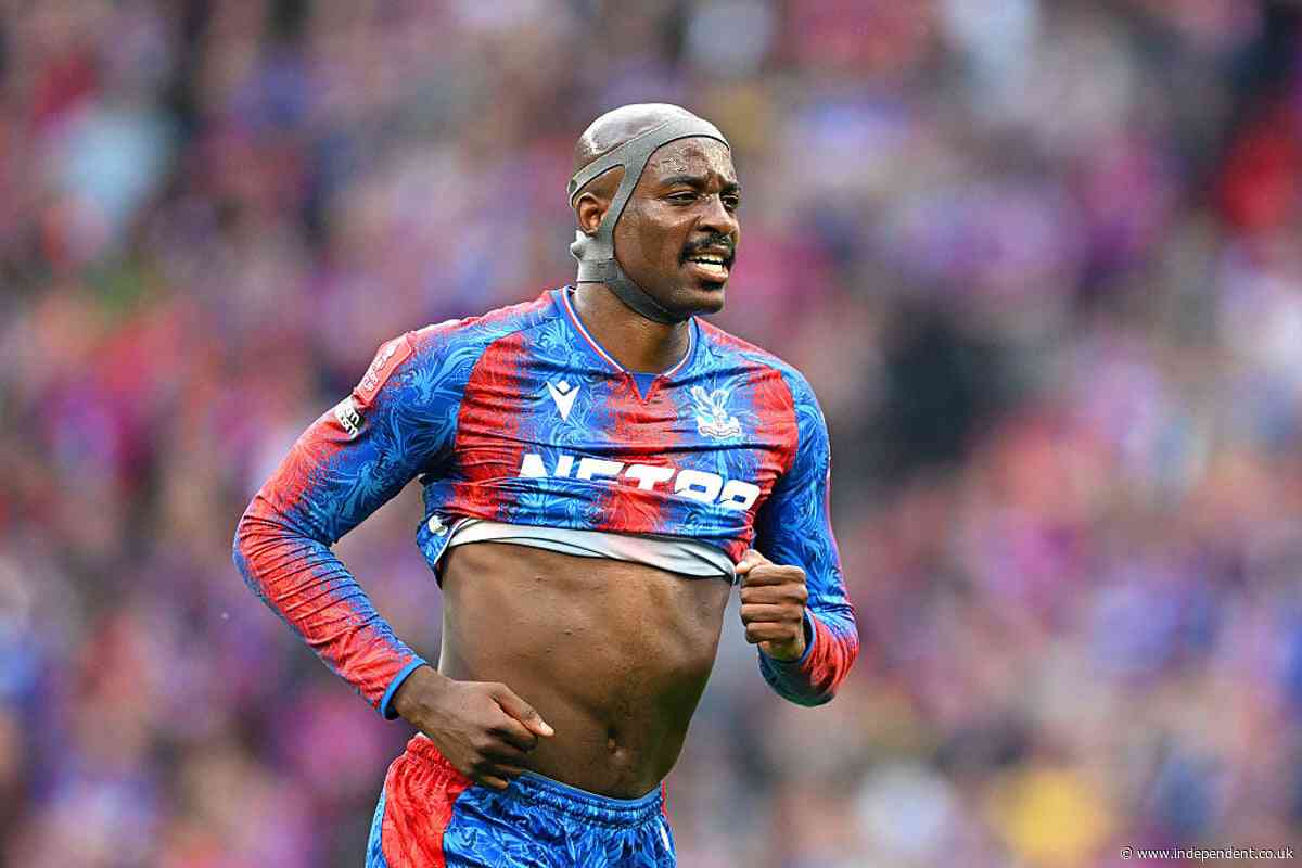 Why is Jean-Philippe Mateta wearing a protective helmet in the FA Cup final?