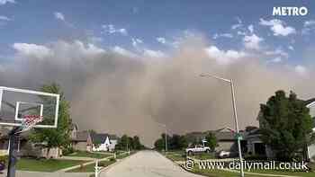 Apocalyptic 'wall of dust' engulfs Chicago as at least 23 are killed and half a million are without power in tornado hellscape