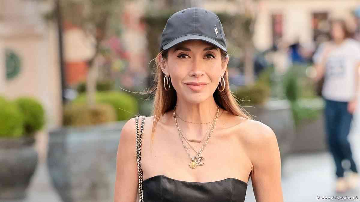 Myleene Klass showcases her very svelte figure in a black corset top as she steps out at Smooth Radio