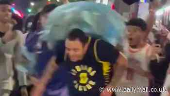 Ugly moment Knicks fans attack rival NBA supporter with trash bag and chase him down street after Celtics win