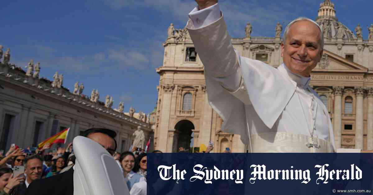 Pope Leo arrives for his inauguration Mass on an electric popemobile