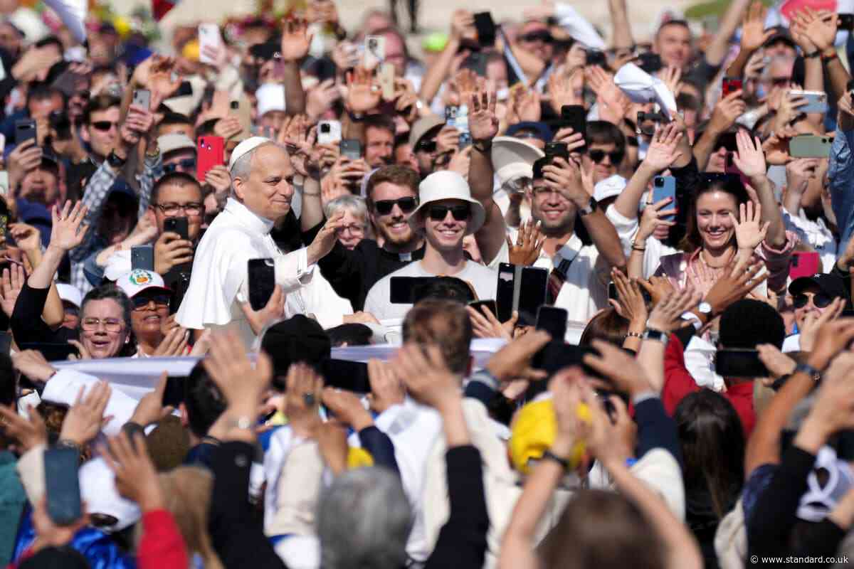 Pope Leo XIV greets tens of thousands from popemobile ahead of historic Vatican inauguration