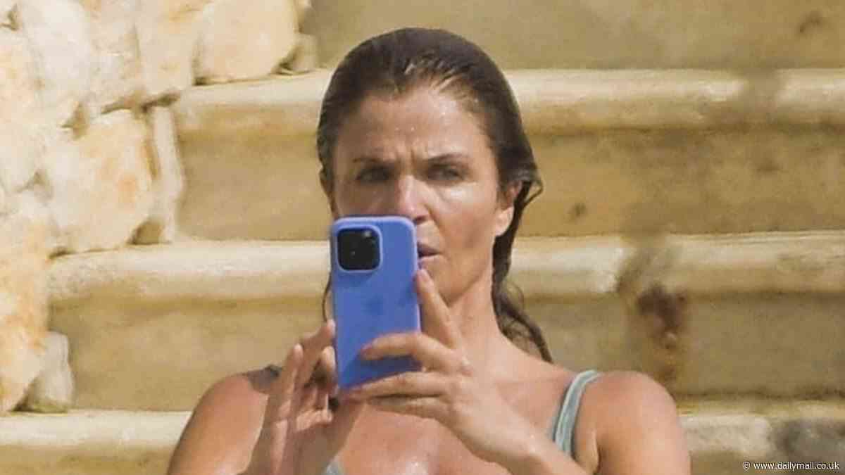 Helena Christensen, 56, shows off her supermodel looks in green swimsuit as she soaks up the sun during Cannes Film Festival