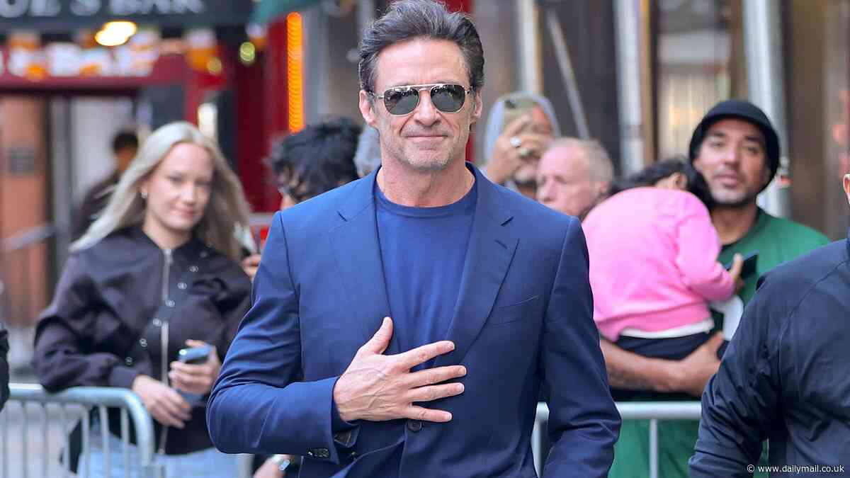 Hugh Jackman looks very happy as he steps out to promote his new theatre show after sparking rumours he has moved in with girlfriend Sutton Foster