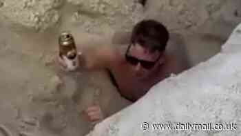 Moment British tourist drinks a beer as he's swallowed by quicksand on beach in Brazil
