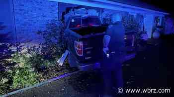 Truck barrels into front of New Roads home