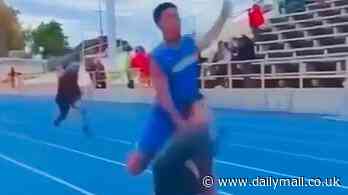 Shocking moment child is knocked over by sprinter after jumping onto the track during a race