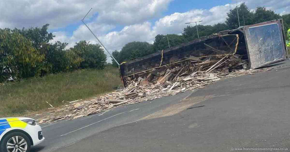 LIVE: Major junction CLOSED as lorry overturns and leaves huge pile of debris - latest updates