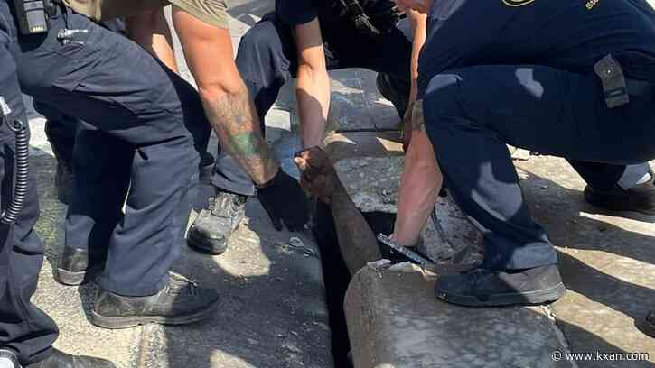 PHOTOS: Austin firefighters rescue man stuck in sewer drain