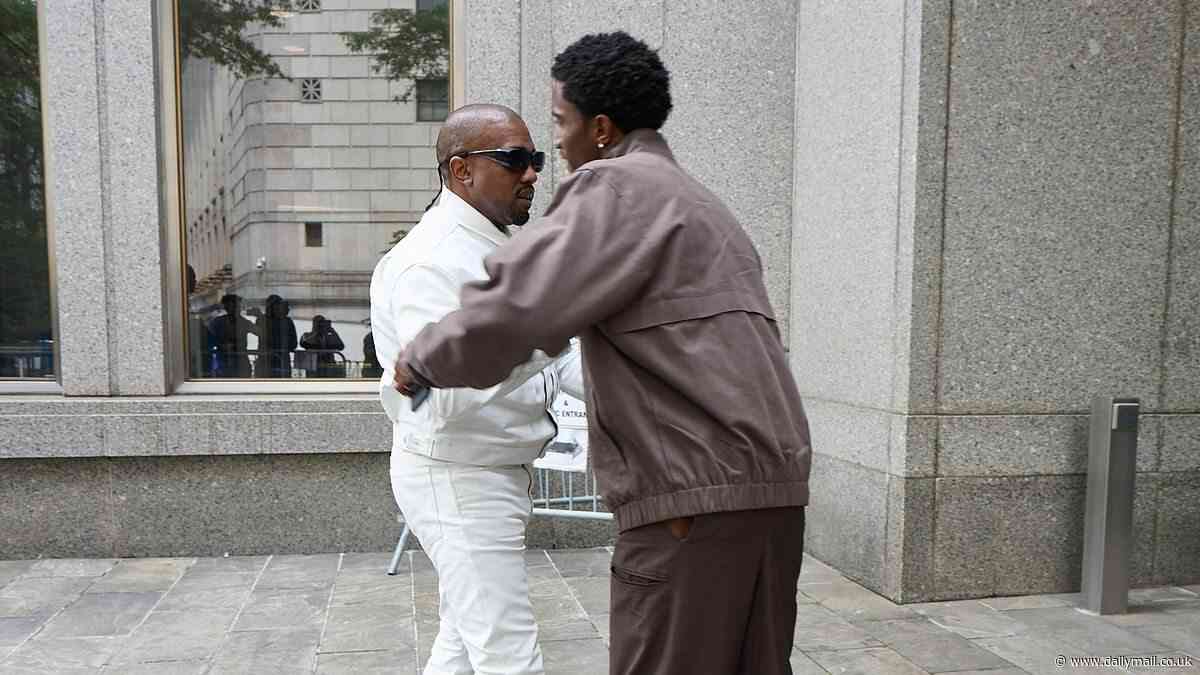 Kanye hugs Diddy's son as he crashes rival rapper's sex trafficking trial in pristine white outfit