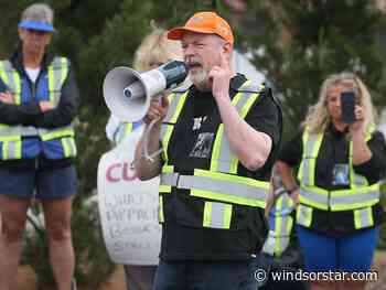 Striking WSIB workers rally in front of Windsor MPP Dowie's office
