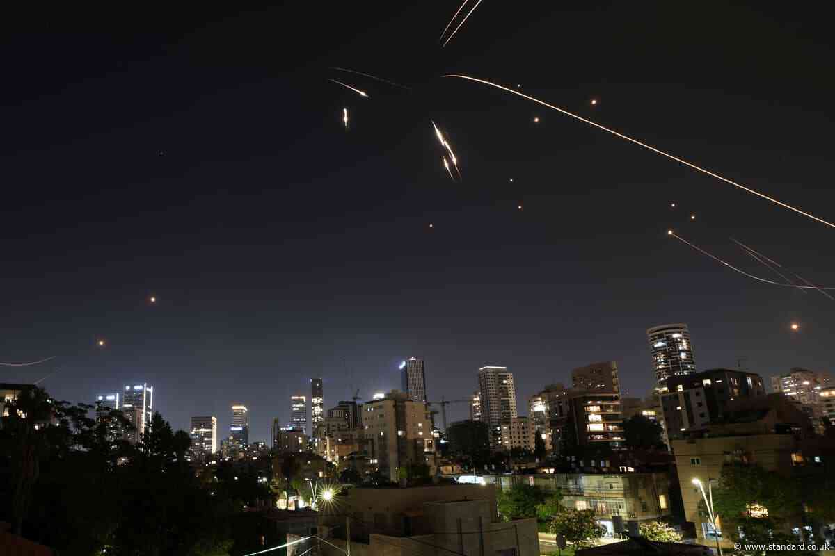 Israel bombarded by Iranian missiles after strikes on Tehran’s nuclear bases