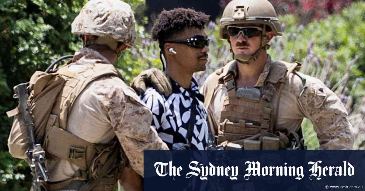 US marines detain first civilian in LA before expected ‘unprecedented’ protests