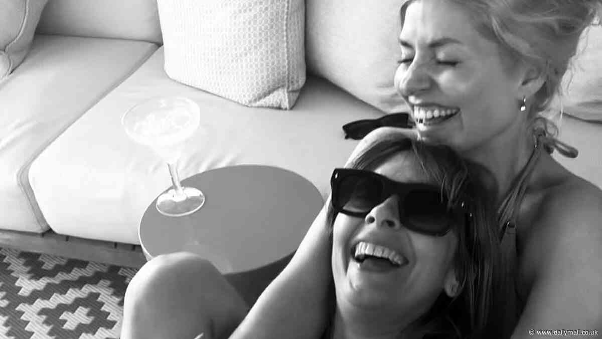 Holly Willoughby looks in good spirits as she enjoys girls' night in with Nicole Appleton - after two of her shows are axed just months apart