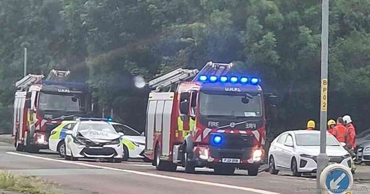 Police car 'badly damaged' in crash on major Manchester road