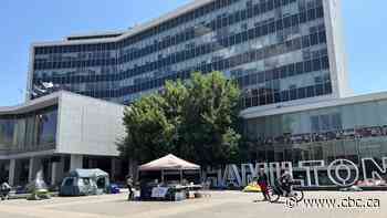 City Hall encampment protesters forced to move from shaded park to concrete amid heat wave