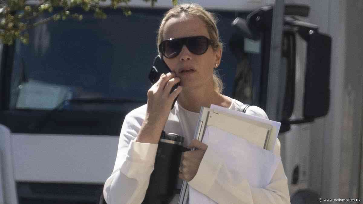 Boss of designer shoe brand Jimmy Choo is banned from driving after being caught driving her £72k Audi without insurance