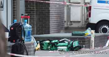 Two dead and two in hospital after four men stabbed at business