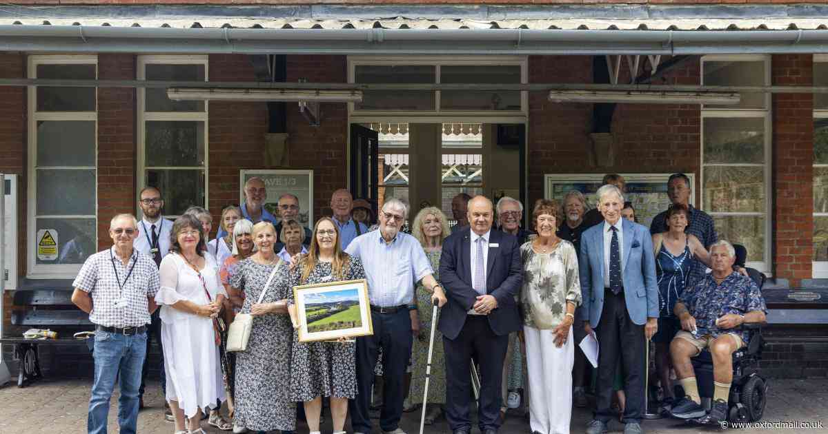 Volunteers honoured with plaque for transforming railway station